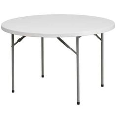 a white round table with four legs