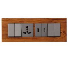 an electrical outlet on a wooden wall with two switches and one light switch in the middle