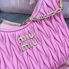 Miu Miu 5BH211 latest version new season bag is an iconic and made of Matelasse embroidered lambskin material, Miu’s unique design, gorgeous shoulder straps highlight unique features, bag body design exudes a refined and elegant style. Metal lettering logo on the front Zipper closure. Color: Pink. Nappa Leather. Cotton satin lining. Gold finished metal hardware. ... Leather Mirror, Miu Miu Bag, Top Collection, Cute Bag, New Handbags, Nappa Leather, Crossbody Shoulder Bag, Elegant Style, Miu Miu