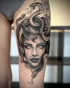 a woman with a snake on her head is depicted in this tattoo design by the artist