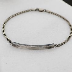 "A sterling silver bracelet with an ID scratched bar for men in black oxidized silver and curb chain. This dainty cuban link chain bracelet is 100% made by hand and it is an excellent choice for a personalized birthday gift for him. DETAILS * Metal: High Quality Sterling Silver 925 * Finish: Black Oxidized * Bar Dimensions: 40mm x 4mm * Length: 7.5 -9 inches 100% nickel free. Delivered in an elegant gift package. S H I P P I N G All orders are now shipped via FedEx Express for speed and security Minimalist Oxidized Bracelets For Everyday, Everyday Minimalist Oxidized Bracelets, Half Moon Necklace, Mens Chain Bracelet, Best Man Gift, Men In Black, Bar Bracelet, Silver Chain Style, Bracelet Men