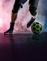 a soccer player with his foot on the ball