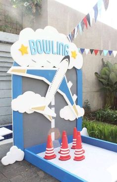 an airplane themed birthday party with cones on the ground