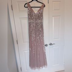 a dress hanging up on a door