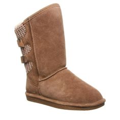 Our classic 'Boshie' in suede and knit back now available in wide width!The suede upper extends up the front of the shaft, with the knit down the back. Attractive branded BEARPAW buckles add some extra flair. The height of this cozy boot is approximately 9 inches in the back, 10 inches in the front, measured from the base of the sole with a 14 inch circumference. Size: 6.  Color: Brown.  Gender: female.  Age Group: adult. Most Popular Shoes, Cozy Boots, Slip On Boots, Shoe Company, Wide Boots, Bearpaw Boots, Winter Boots Women, Winter Women, Snow Boots