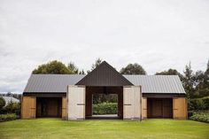 an open barn style building with two doors on each side