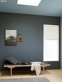 a room with blue walls and wooden flooring