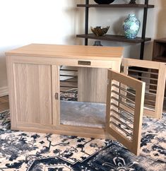 a wooden cabinet sitting on top of a rug