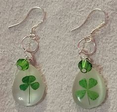 These are an fun pair of shamrock 4 leaf clover earrings.  They would be so much fun to wear at St Patrick's time. They hang approximately 2in. and are about .5in wide. A single green Swarovski crystal accent 4 Leaf Clover, Dollar Tree Diy Crafts, Clover Earrings, Saint Patricks, Earring Holder, Four Leaves, Tree Diy, Saint Patrick, Deer Hunting