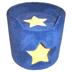 a blue cat bed with yellow stars on it