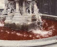 a fountain with water spouting from it's sides