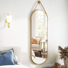 a bedroom with a large mirror on the wall