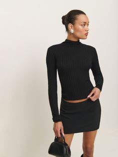 Layer up. Shop the Cori Ribbed Turtleneck Sweater from Reformation, a long-sleeve, lightweight sweater with a mock neckline and ribbing throughout. Black Turtle Neck Layered Outfit, Ribbed Fitted Long Sleeve Top For Layering, Elegant Long Sleeve Turtleneck With Ribbed Neckline, Elegant Long Sleeve Mock Neck Top For Winter, Chic Ribbed Long Sleeve Top With Stretch, Chic Fitted Sweater With Ribbed Neckline, Chic Ribbed Fitted Mock Neck Top, Chic Fitted Mock Neck Top For Winter, Chic Mock Neck Long Sleeve Top For Workwear