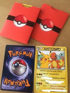 two pokemon cards and some other items on a table