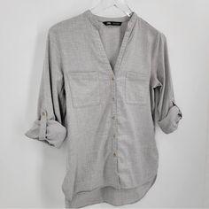 Zara Button Up V-Neck Gray Cotton Top Long Sleeve Roll Tab Sleeves Size Small. Approximate Measurements: Armpit To Armpit- ~19” Length: Front ~25” Back ~27” Casual Blouse With Buttons And Split Neck, Gray V-neck Tops With Button Closure, Casual Blouse With 3/4 Sleeves And Button Cuffs, Casual Split Neck Blouse With Button Closure, Casual Blouse With 3/4 Sleeves And Buttons, Gray Button-up Blouse With Buttons, Gray Button-up Blouse, Casual V-neck Blouse With Button Cuffs, V-neck Blouse With Roll-up Sleeves For Work