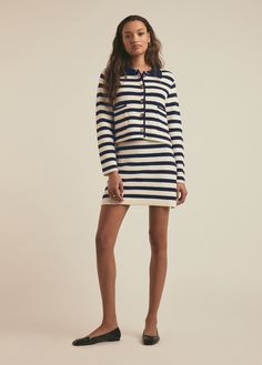 A relaxed, boxy-fit cardigan that's a true outfit completer. Patch front pockets, faux horn buttons and a shirt collar give this cardi a tailored look. It's cut from a structured cotton-comfort blend in a seasonal navy stripe to add some texture to your warm weather styles and looks especially chic when paired as a set with The Annabel Skirt.73% Cotton, 19% Nylon, 8% Spandex BlendMegan is 5'10" wearing size S. Lameka is 5.9.5" wearing size XS. Fitted Cardigan, Favorite Daughter, Striped Cardigan, Navy Stripes, Striped Knit, Shirt Collar, Knitting Designs, Summer Wardrobe, Warm Weather