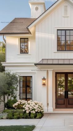 a white house with black trim and windows