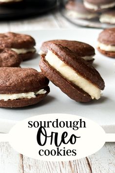 chocolate sandwich cookies with cream filling on a white plate