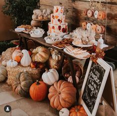 a table filled with lots of different types of food and desserts on top of it