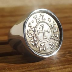 Handmade Knights Templar Coin Signet Ring Handcrafted The ring was made especially to embed a coin that fits perfectly into the space provided for this purpose. The edge of the ring highlights the coin while protecting it. This ring is made of high quality solid stainless steel which will guarantee you long-term use and its finish is exceptional. This is a magnificent replica of the Anonymous Denarius (1100-1200). The replica used is made of high quality silver plated copper with very nice finis Class Rings, Signet Ring, Class Ring, Free Gifts, Silver Plate, Jewelry Rings, Gift Box, Accessory Gift, Copper