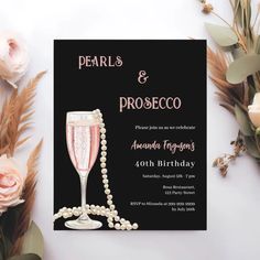 pearls and prosecco birthday party card with champagne glass, pearls and roses on the table