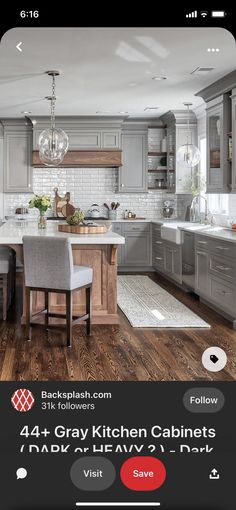 a kitchen with gray cabinets and white counter tops is featured on the instagram page