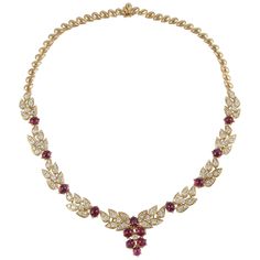 Adler necklace in 18K yellow gold featuring cabochon rubies accented by diamonds. Marked "Adler's France 18K" on the tongue closure. There are fourteen (14) cabochon rubies totaling 15.85 carats. There are also 113 round diamonds that total 6.25 carats, G-H color and VVS-VS clarity. The necklace measures 14 inches long. Luxury Gold Plated Red Necklace, Luxury Yellow Gold Ruby Bridal Necklace, Diamond Cabochon Necklace For Anniversary, Gold Diamond Necklace With Cabochon, Luxury Yellow Gold Ruby Necklace, Luxury Ruby Necklace In Yellow Gold, Formal Yellow Gold Necklace With Ruby, Formal Yellow Gold Ruby Necklace, Luxury Red Cabochon Necklaces