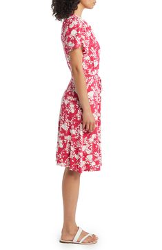 Bring vintage-inspired charm to your wardrobe with this knee-length dress patterned with a retro floral print and cut in a faux-wrap silhouette. 38" length Surplice V-neck Short sleeves Unlined 95% rayon, 5% spandex Machine wash, dry flat Imported Printed Knee-length Midi Dress For Garden Party, Fitted Midi Dress With Floral Print And Surplice Neckline, White Knee-length Floral Dress, Feminine Fitted Knee-length Wrap Dress, Fitted Feminine Knee-length Wrap Dress, Fitted Knee-length Feminine Wrap Dress, Printed Fitted Knee-length Floral Dress, Fitted Floral Printed Knee-length Dress, Spring Knee-length Fitted Wrap Dress