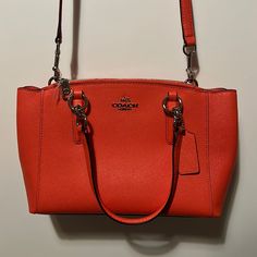 Bright Orange Coach Crossbody/Handbag In New Condition Coach Orange Crossbody Bag, Coach Orange Satchel Bag, Coach Orange Bag With Detachable Strap, Orange Travel Bag With Silver-tone Hardware, Orange Bags With Silver-tone Hardware, Green Coach Purse, Orange Purse, Coach Crossbody Purse, Pink Crossbody Bag