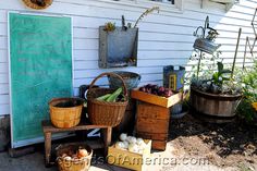 an outdoor area with baskets and vegetables on the ground