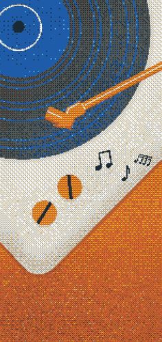 a record player with an orange and blue design on it's cover is shown