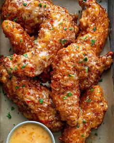 chicken wings with sauce and parsley on the side