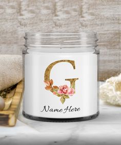 a personalized candle with the letter q on it