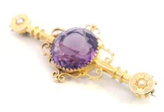 Discover the timeless elegance of this antique pressed and assembled brooch, featuring a captivating 13mm round cut amethyst and delicate half seed pearls. Hallmarked in Birmingham in 1916, this brooch showcases exquisite craftsmanship and historical charm. Details:     Materials: Pressed and assembled     Gemstones: 13mm round cut amethyst in a multi-claw mount, half seed pearl star set at each end     Dimensions: 50mm x 20.3mm     Weight: 5.3 grams     Hallmarks: Birmingham 1916, 15 (.625) Thi Pretty Clothes, Pearl Brooch, Seed Pearl, Classic Beauty, Antique Jewellery, Vintage Jewellery, Deep Purple, Birmingham, Hallmark