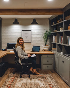 a woman sitting at a desk in an office