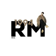 a man sitting on top of a black and white sign with the words r & m