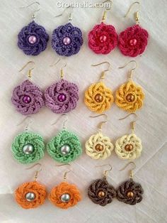 crochet flower earrings in different colors and sizes with pearls on the earwires