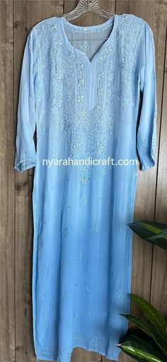 "Chikankari blue kurta on fine flowy georgette. Beautifully hand embroidered! Liner included. Kurti length-47 inches \"Embroidery designs vary \"" Blue Georgette Kurta For Summer, Summer Blue Georgette Kurta, Blue Chikankari Embroidery Straight Kurta, Blue Chikankari Embroidered Straight Kurta, Blue Straight Kurta With Chikankari Embroidery, Fitted Light Blue Chikankari Kurta, Semi-stitched Light Blue Kurta With Chikankari Embroidery, Light Blue Semi-stitched Kurta With Chikankari Embroidery, Light Blue Anarkali Kurta With Chikankari Embroidery