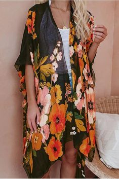 Step your look up a notch in our Shady Beach Floral Kimono! Printed with golden yellow, green, blush, orange, and mauve florals on a sheer black base. The open front design, side slits, and kimono sleeves add volume to the effortless layer. Keep your look simple with a basic tank and denim and let the kimono do the work for you! Relaxed Fit Open Front 100% Polyester Hand Wash Cold, Lay Flat to Dry Side Slit Lightweight Sheer One Size: Length measures 40” from shoulder to hem Bath Dress, Beach Floral, Floral Print Kimono, Kimono Sleeves, Print Kimonos, Split Dress, Floral Kimono, Kimono Sleeve, Ripped Denim