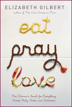 the book eat pray love by elizabeth gilbertt is shown in gold and red