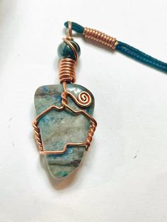 Handmade Copper Wire Wrap Necklace, Ready to wear with a high quality 24 inch black cord. Unique Hand Wrapped Jewelry With Waxed Cord, Unique Hand Wrapped Jewelry On Waxed Cord, Artisan Necklace With Adjustable Cord For Healing, Handmade Artisan Jewelry With Waxed Cord, Artisan Handmade Jewelry With Waxed Cord, Adjustable Copper Wire Necklace With Round Pendant, Handmade Waxed Cord Pendant Jewelry, Handmade Artisan Necklaces With Waxed Cord, Handmade Artisan Necklace With Waxed Cord