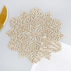 a piece of paper that has been cut into snowflakes