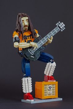 a lego guitar player is posed for the camera