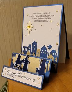 a christmas card with the nativity scene on it, and an envelope that says congratulations