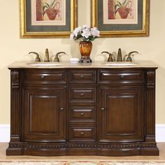 a bathroom vanity with two sinks and a large painting on the wall behind it,