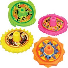 four plastic toys with different shapes and colors on them, including one in the center