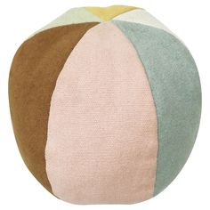 a multicolored round pillow on a white background