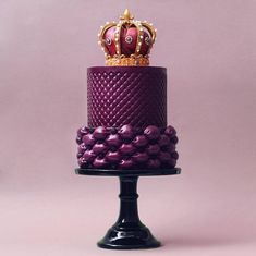 a purple cake with a crown on top