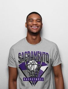 Sacramento Basketball 90s Throwback Unisex Shirt The unisex heavy cotton tee is the basic staple of any wardrobe. It is the foundation upon which casual fashion grows. All it needs is a personalized design to elevate things to profitability. The specially spun fibers provide a smooth surface for premium printing vividity and sharpness. No side seams mean there are no itchy interruptions, under the arms. The shoulders have tape for improved durability. .: 100% cotton (fiber content may vary for d Miami Basketball, Chicago Basketball, Los Angeles Basketball, 90s Throwback, Retro Football Shirts, Retro Sports, Retro Tee, Cute Tshirts, Vintage Tees