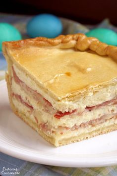 a piece of pizza sitting on top of a white plate